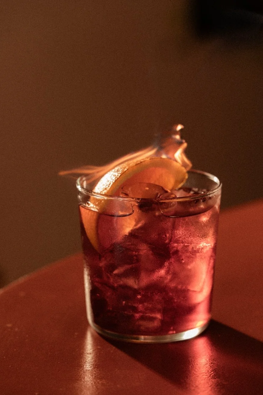 Flaming Oaxacan Negroni at Pūblico Mezcaleria — the most dramatic mezcal cocktail in Mykonos